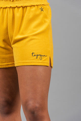 Close up of yellow TopGun shorts