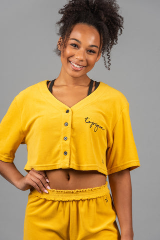 Front image of yellow TopGun top